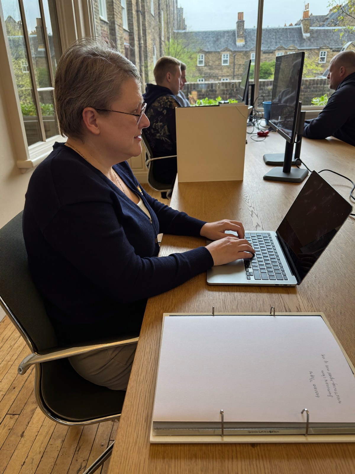 Business owner preparing company records in a quiet study